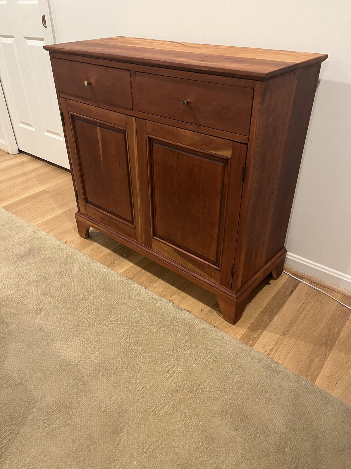 Refinished sideboard with warm tone