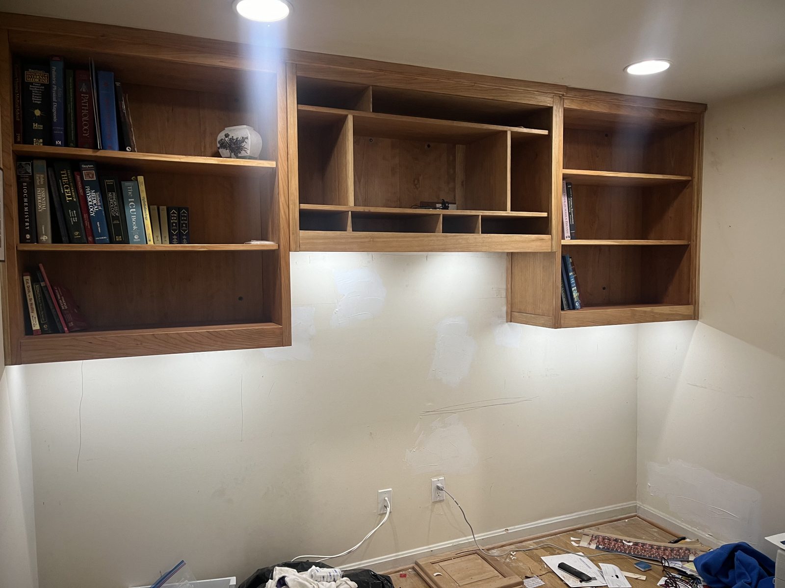 Built-in shelving partially installed on the wall