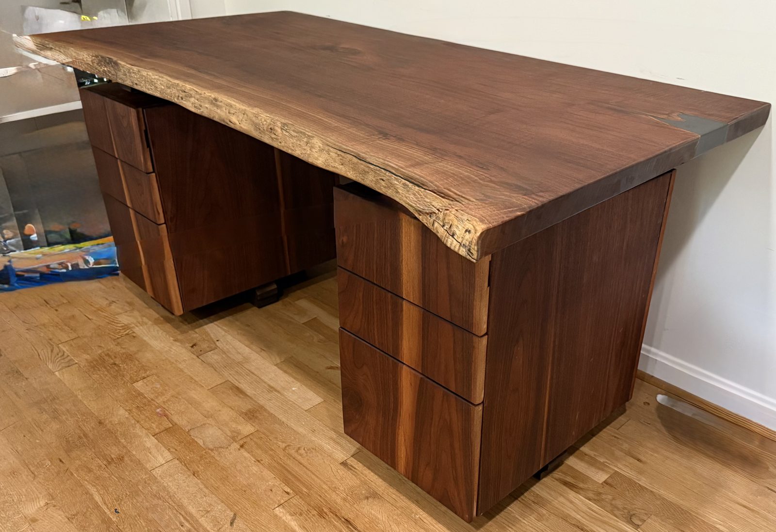 A finished live-edge walnut desk